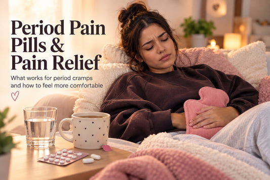 Woman resting with a hot water bottle, period pain pills and a warm drink for period pain relief.