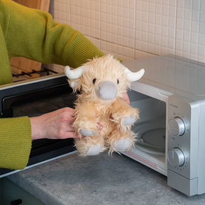 Weighted plush to next to a microwave ready to be heated